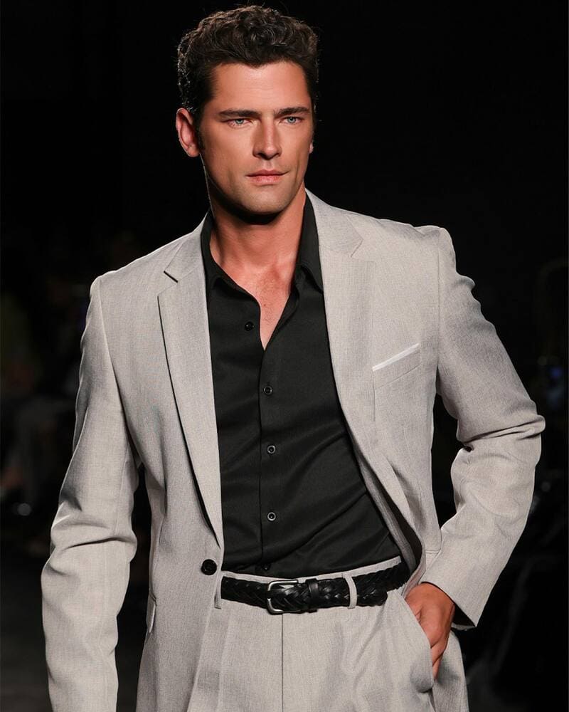 man wearing a two piece grey suit