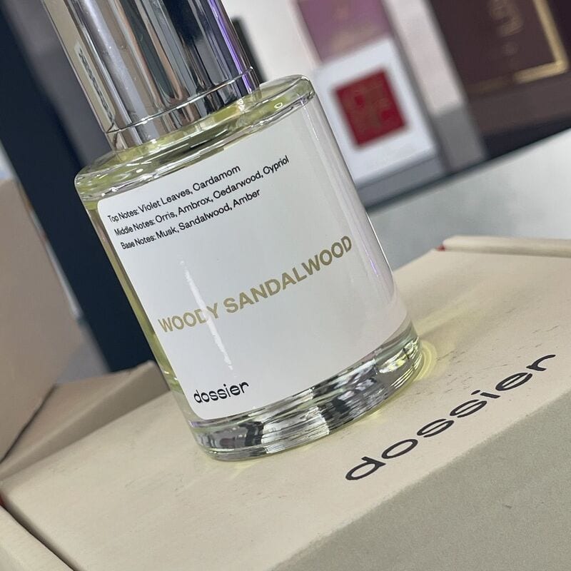 a bottle of Dossier Woody Sandalwood perfume