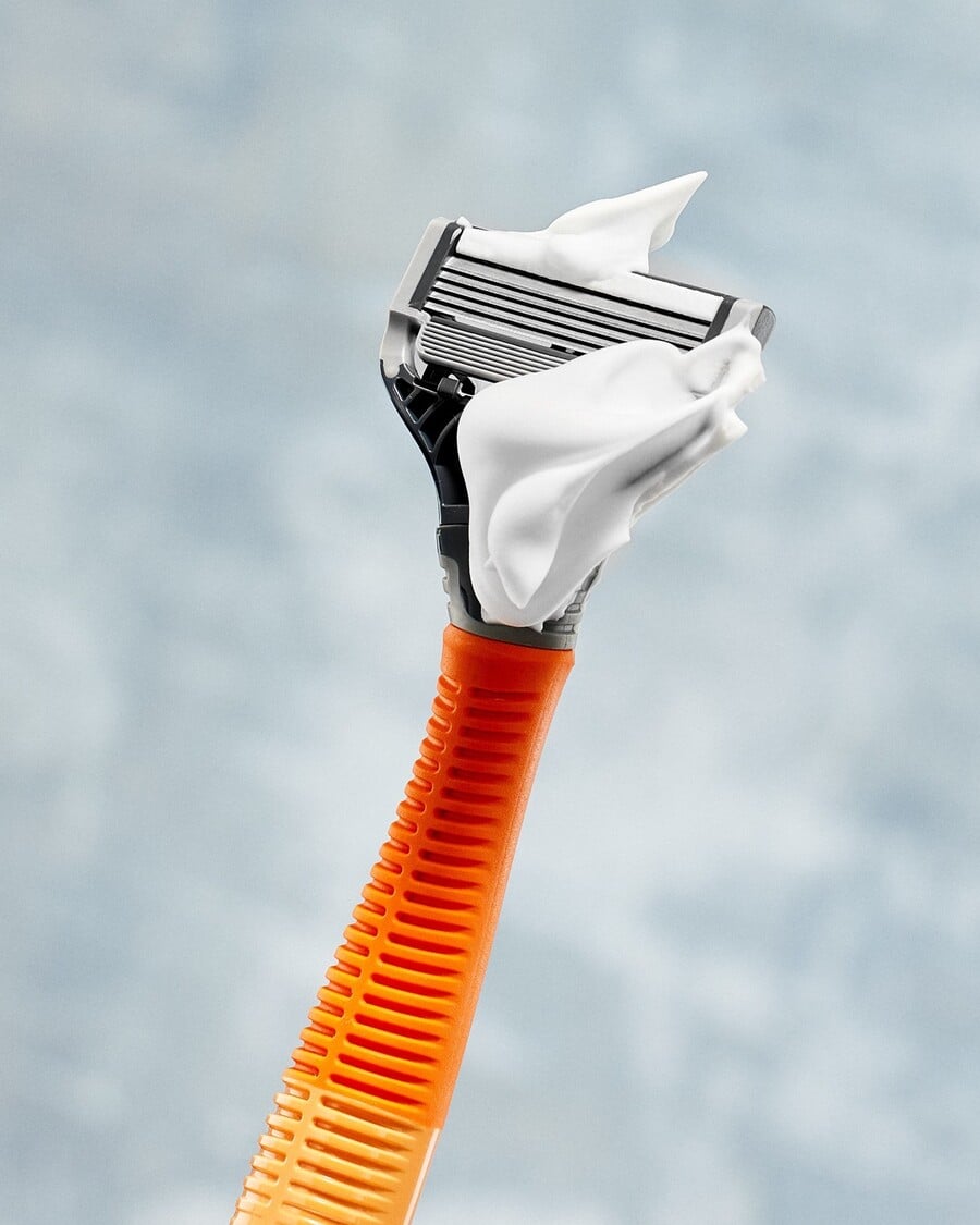 The Harry's Razorin in Ember with a bit of shaving cream on
