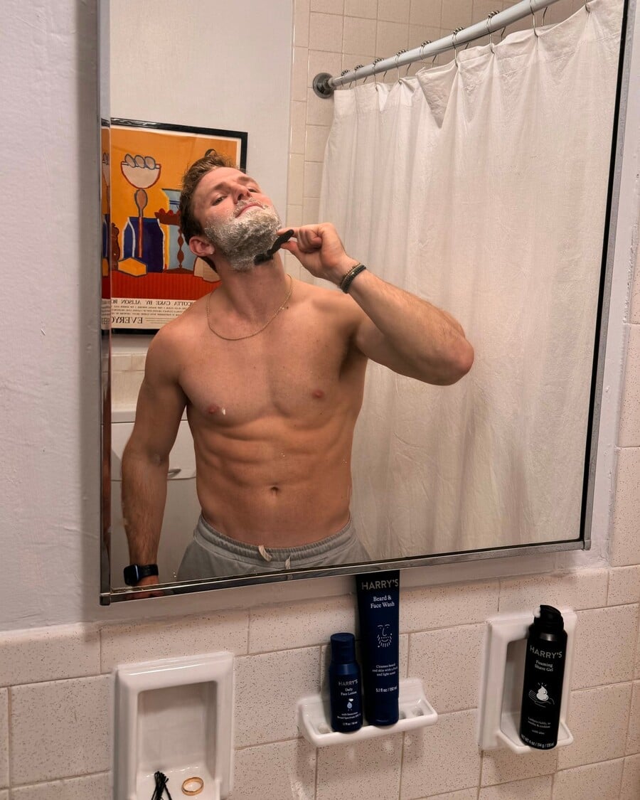 man shaving beard under the chin