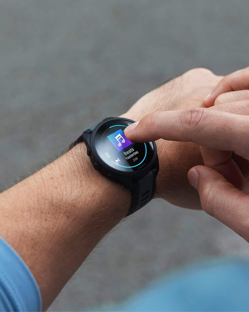 man playing music in his garmin watch