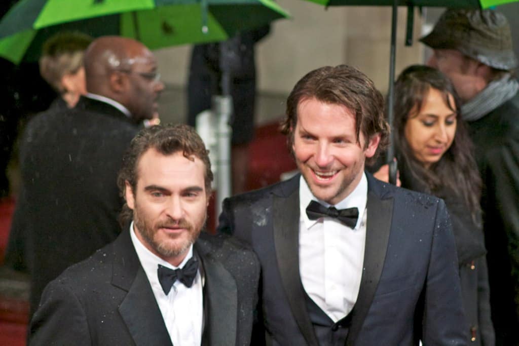 Bradley Cooper in a tuxedo with joaquin phoenix
