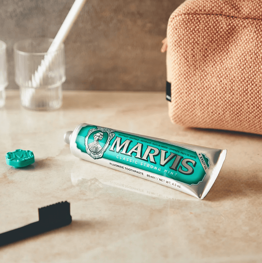 dopp kit, toothbrush and marvis toothpaste