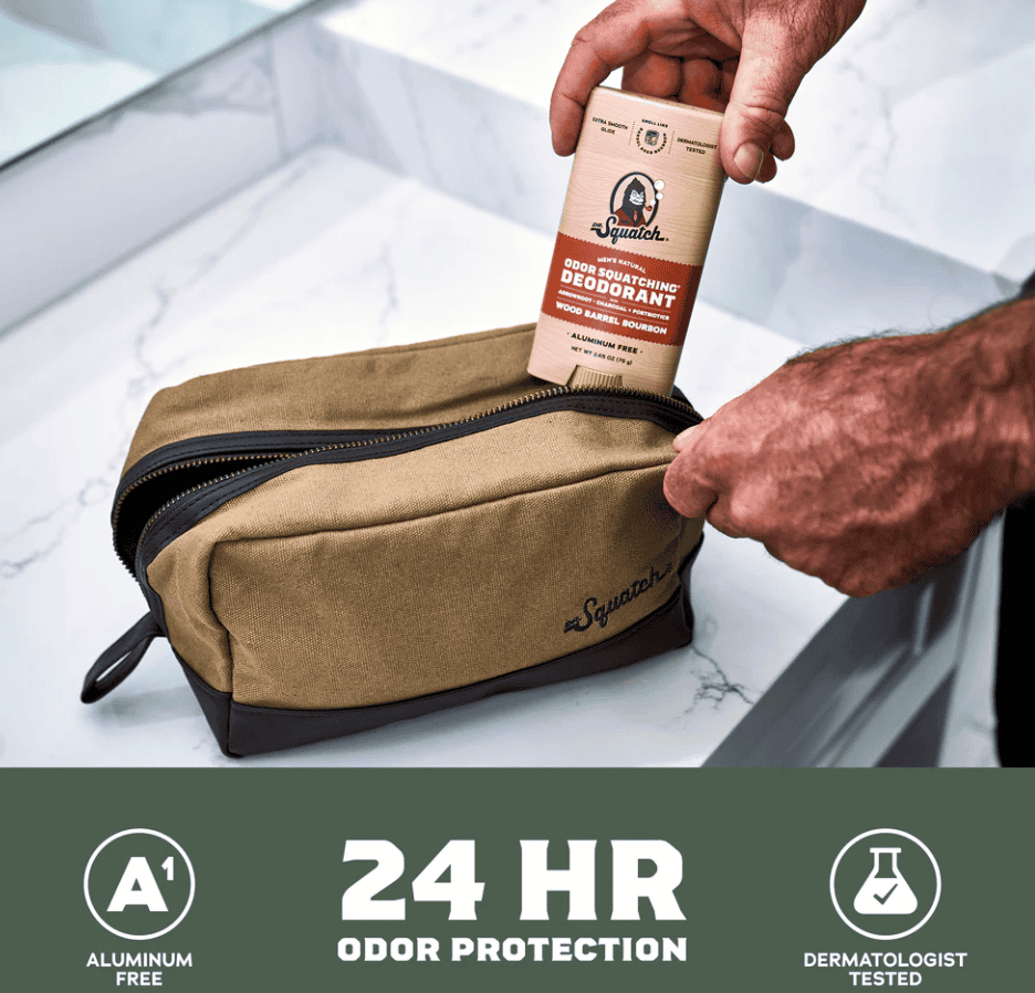 Man pulling a Dr Squatch Deodorant stick out of a toiletries bag in a bathroom