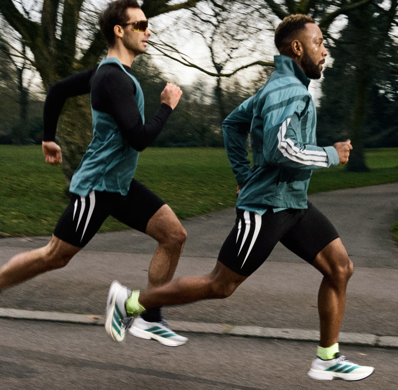 Running in athletic apparel outdoor, two men jogging in park, workout, sports, fitness, casual sportswear, activewear men, outdoor exercise, running gear, gym, training, athletic clothing, healthy lifestyle, men's fashion.
