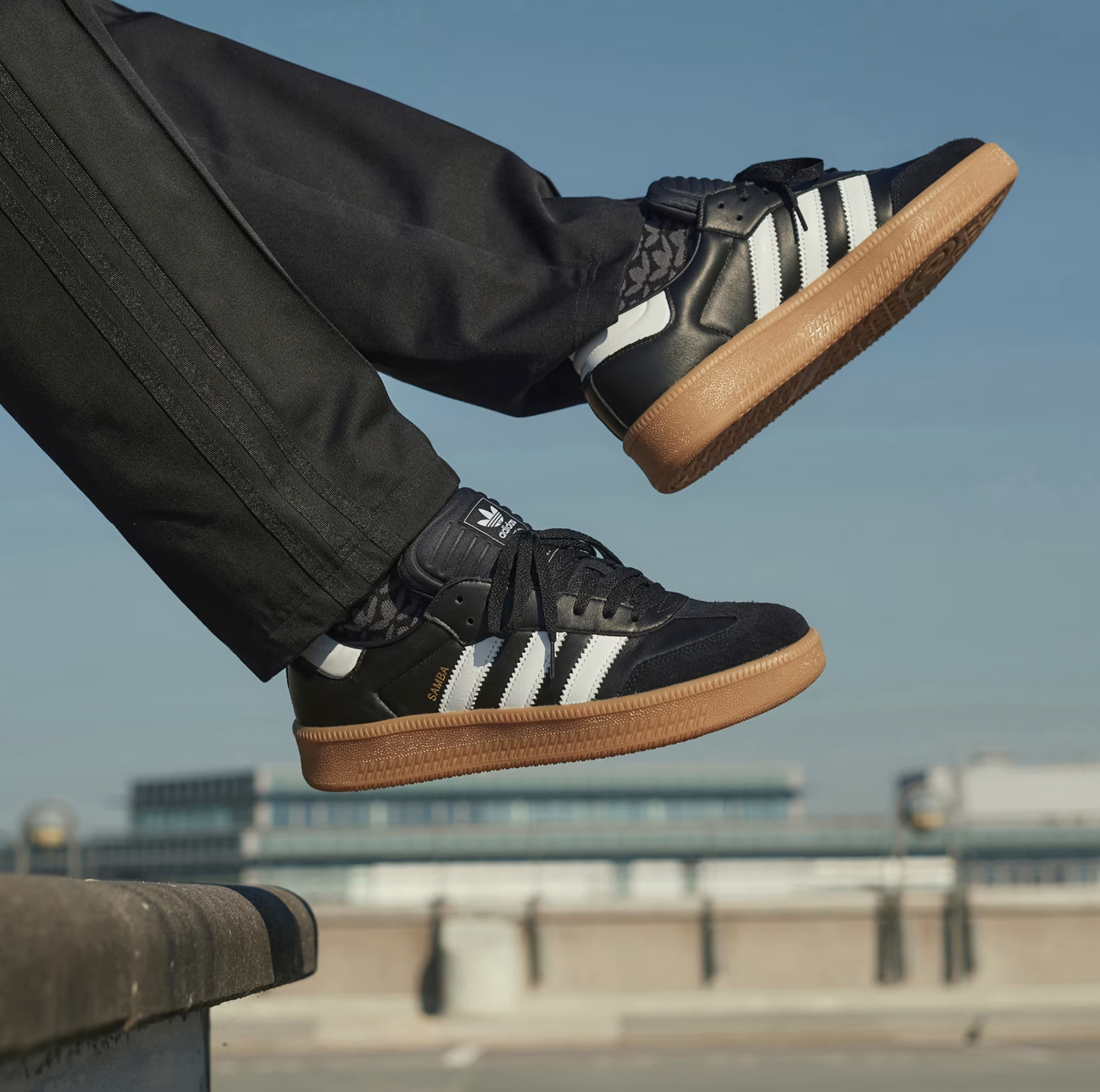 Adidas samba sneakers black and white with gum sole, sporty casual footwear for men.